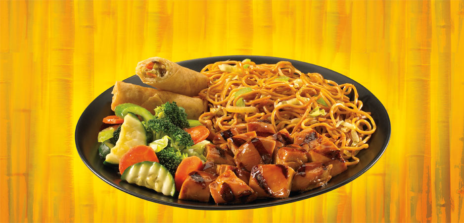 Plate of Chinese food, noodles, chicken, veggies and egg roll