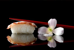 Sushi with chop-sticks and flower